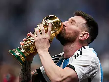 Lionel Messi kissing the FIFA World Cup trophy